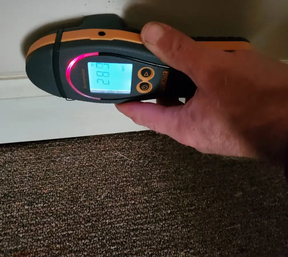 Moisture detection at baseboard during Storm Damage Restoration in Fruitland